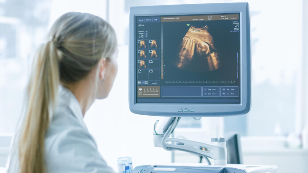 In the Hospital, Obstetrician Uses Transducer for Ultrasound/ Sonogram Screening