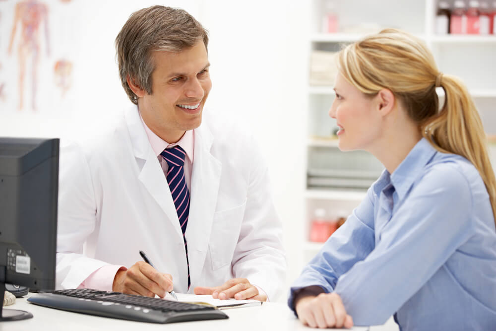 Doctor Talking To Female Patient