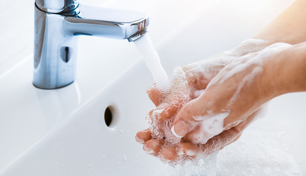 Woman Use Soap and Washing Hands Under the Water Tap.