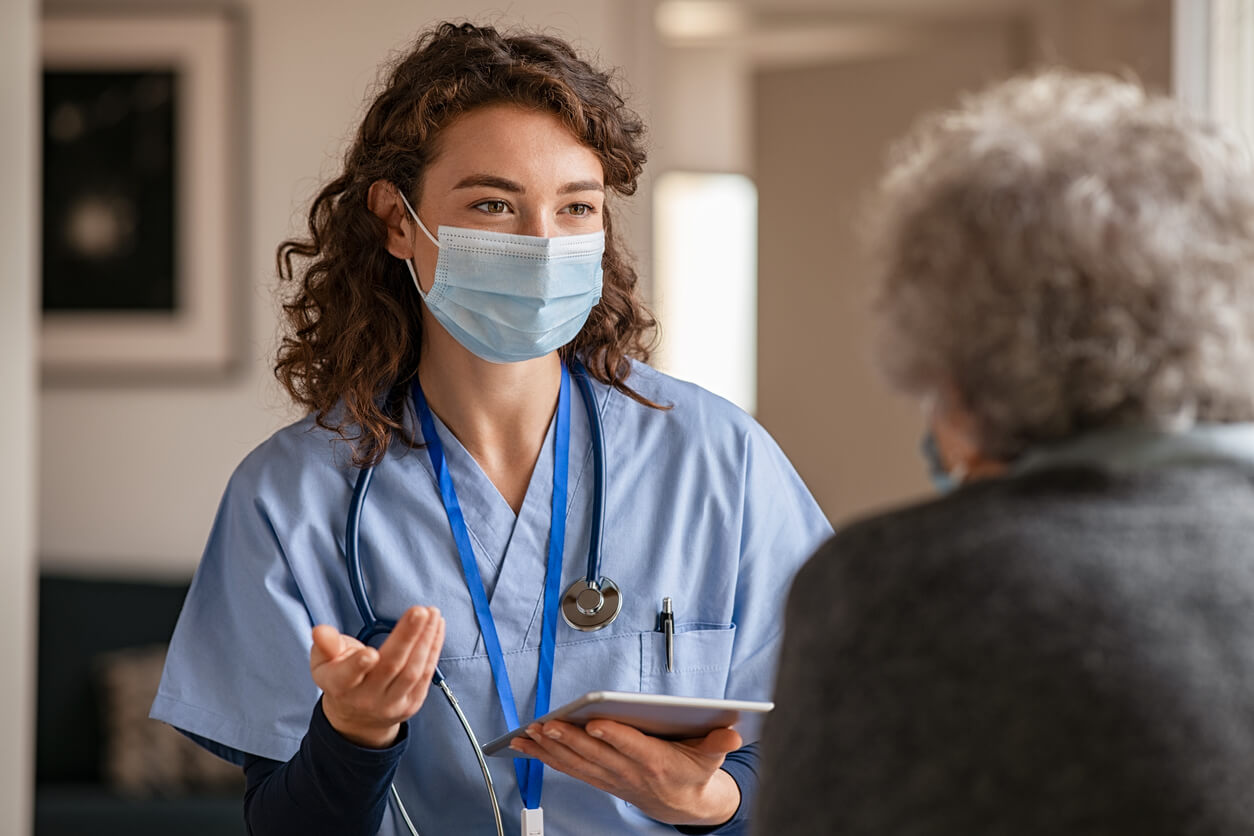 A Nurse Talking to a Patient