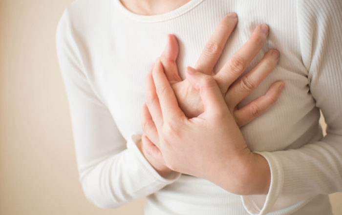 Young Female Suffering From Severe Chest Pain.