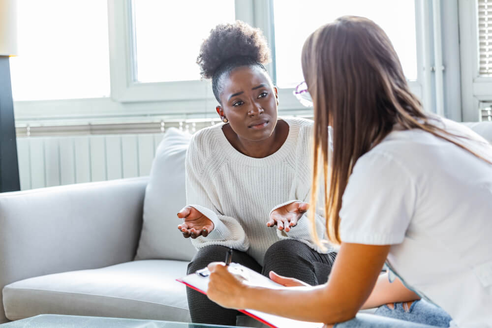 Patient Receiving Bad News, Doctor Support and Comforting Her Patient With Sympathy.