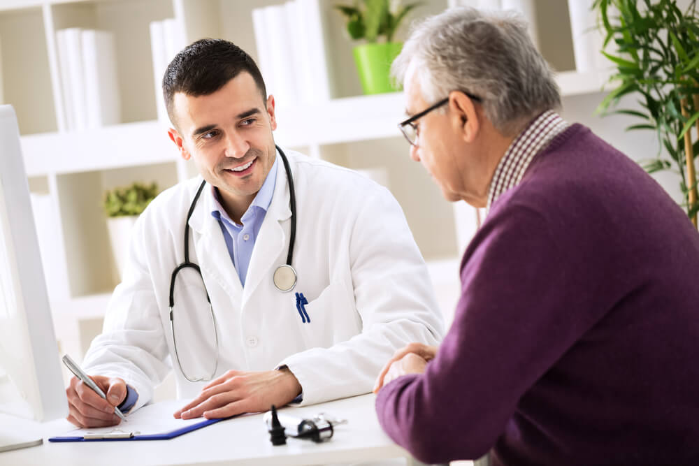 Doctor Explaining Prescription to Senior Patient, Healthcare Concept
