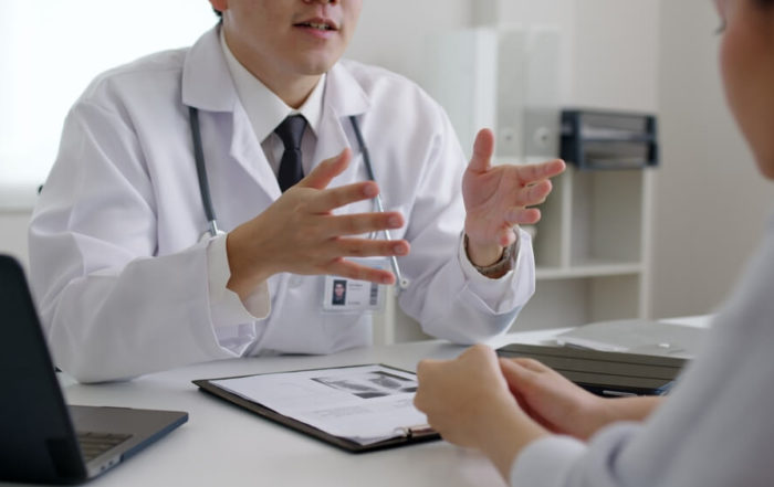 Woman Talking to Doctor
