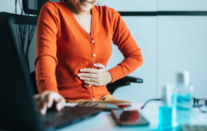 Asian Woman Having Painful Stomach Ache During Working From Home