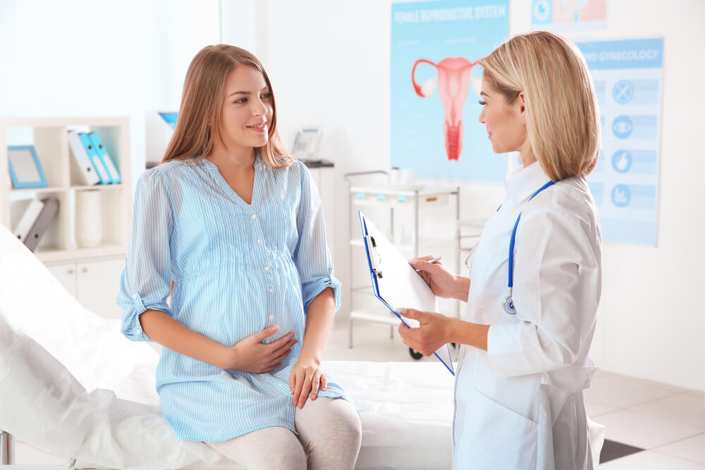 Gynecology Consultation. Pregnant Woman With Her Doctor in Clinic