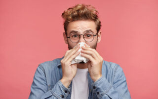 Indoor Shot of Bearded Man Has Running Nose Because of Allergies