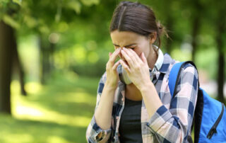 A future patient of Allergy & Immunology Center suffering from allergy symptoms.