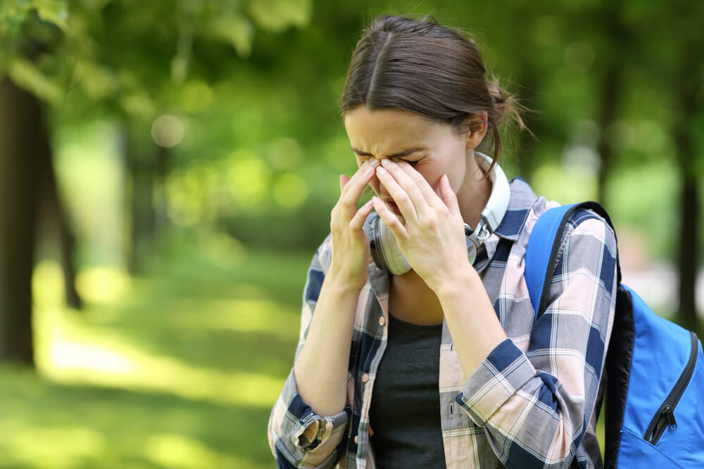 A future patient of Allergy & Immunology Center suffering from allergy symptoms.