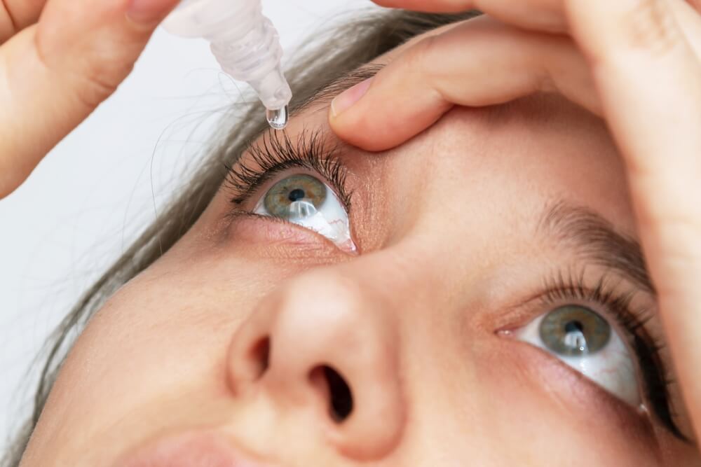 Close-up of Woman Dripping Her Eyes With Medicinal Drops Natural Tear