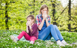 Two People With Allergy Symptom Blowing Nose