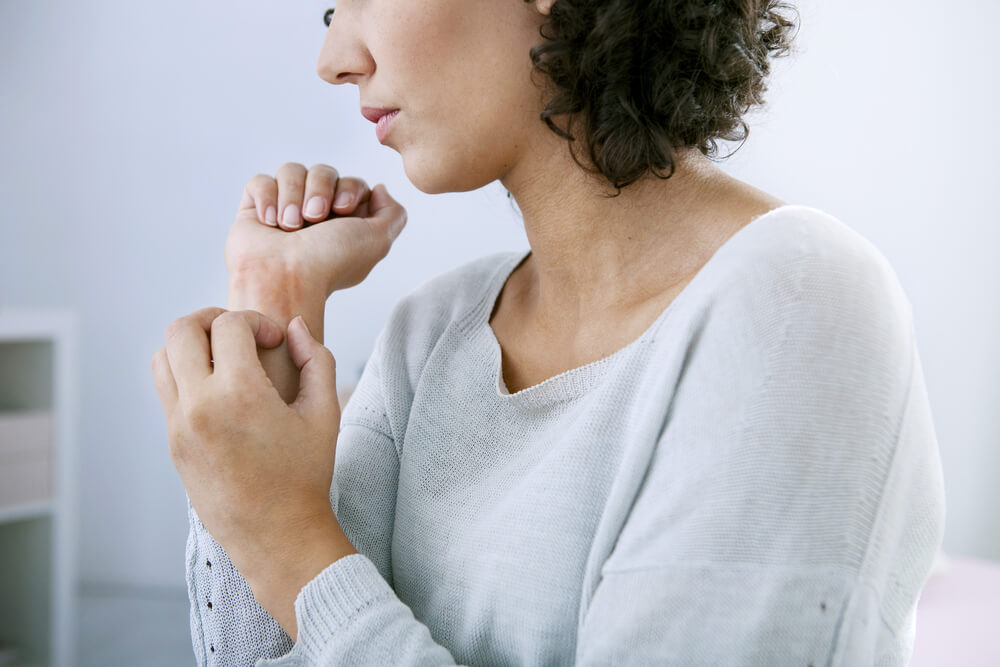 Woman Scratching Her Hand