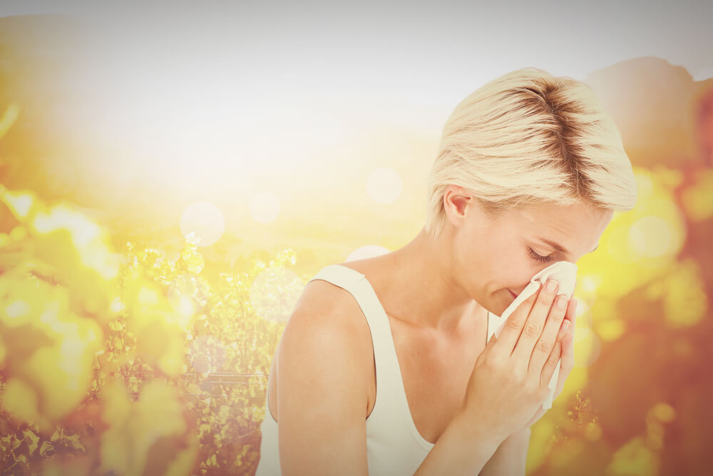 Sick Woman Blowing Her Nose Against Autumn Scene