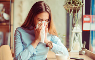Flu. Young woman got nose allergy