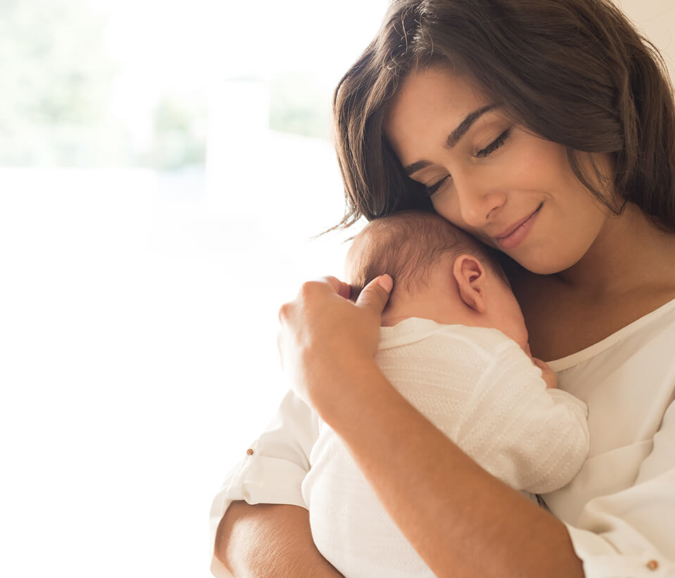 Content Mother Holding Her Newborn Baby on Her Chest