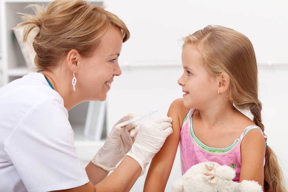 Brave Little Girl Receiving Injection With a Smile