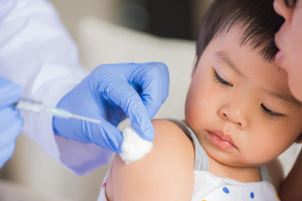 Doctor Giving a Vaccine to a Girl