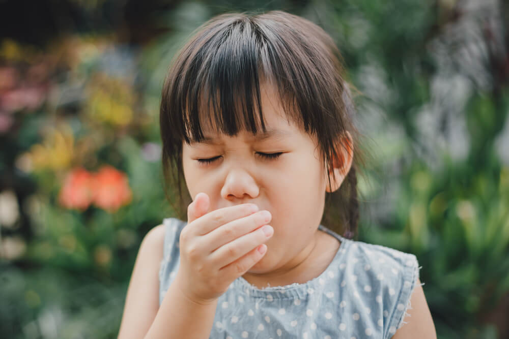 Kids Using Hand Covering Her Mouth While Coughing