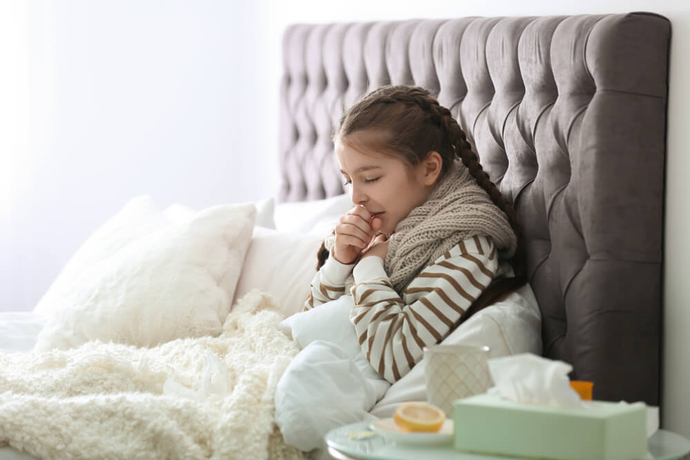 Sick Little Girl With Cough Suffering From Cold in Bed