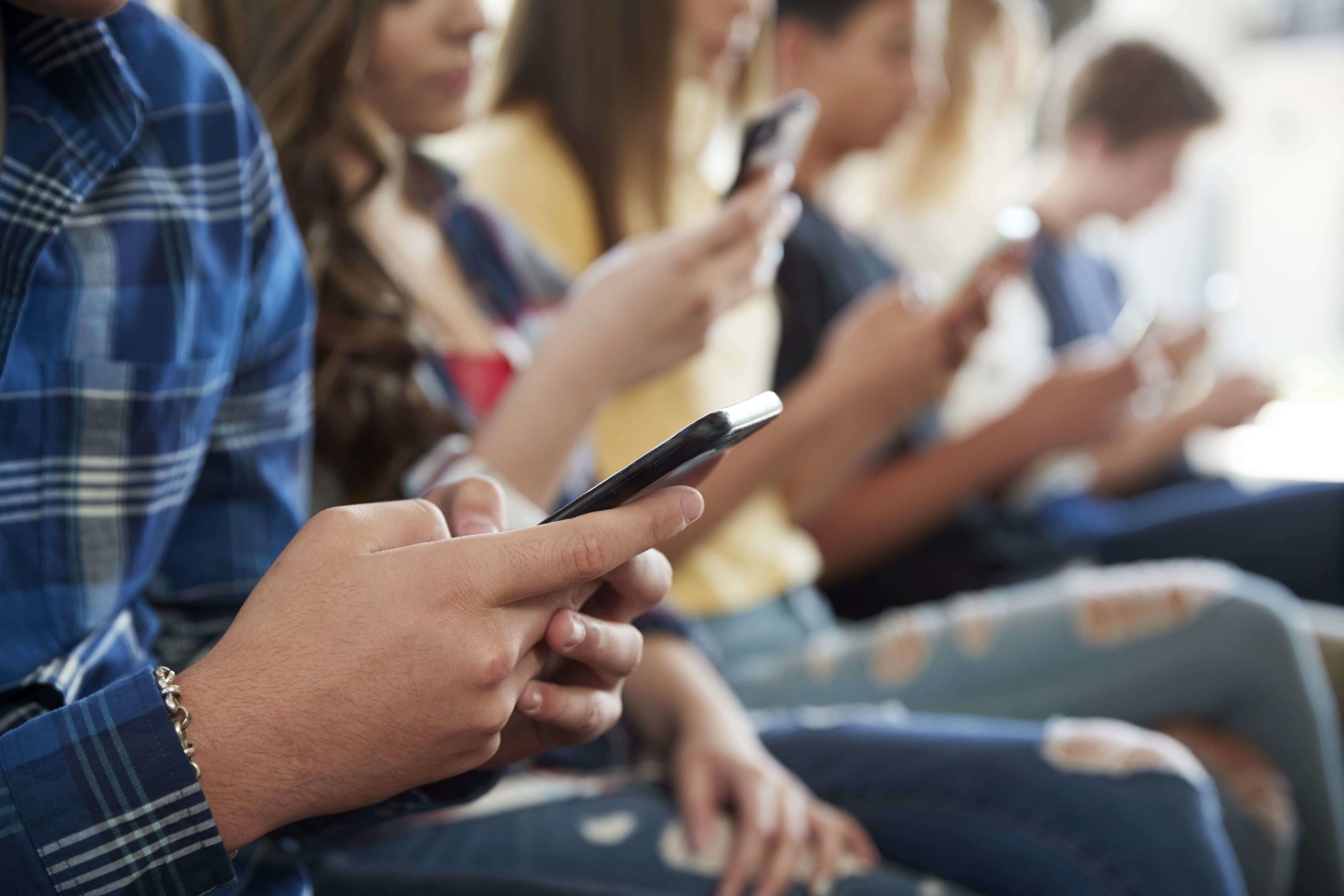 Teenagers Using Smartphones