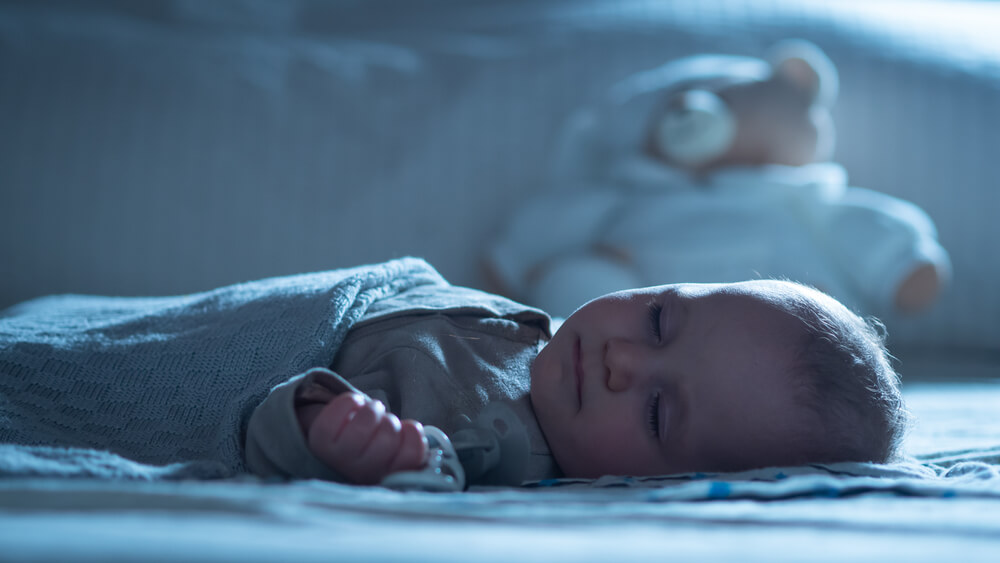 Should newborn sleep with hat on clearance