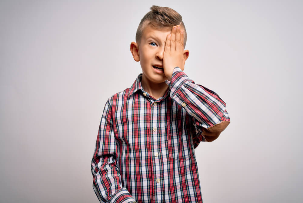 Young Little Caucasian Kid With Blue Eyes Wearing Elegant Shirt Standing Over Isolated Background