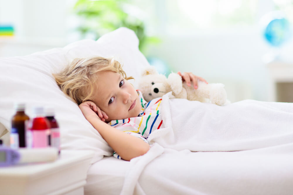 Sick Little Boy With Asthma Medicine. Ill Child Lying in Bed