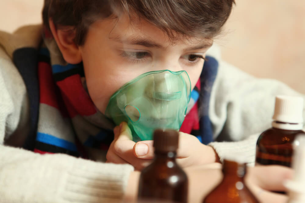 Boy With Electric Inhaler As A Curation Against Virul Disease Flue