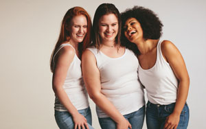 Diverse-group-of-women-laughing-together-on-white-background-smallL | Andrew Krinsky, MD, FACOG
