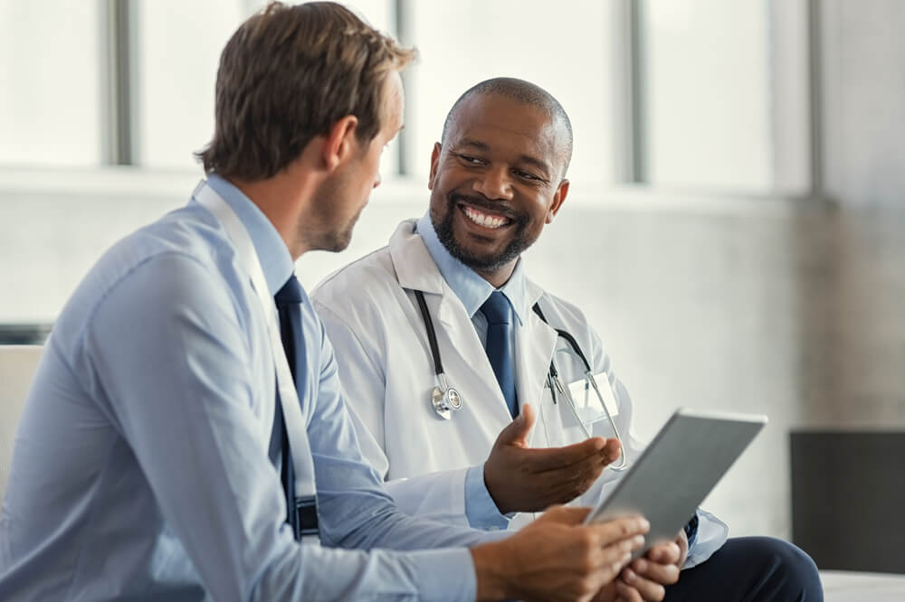 A Doctor Talking to a Man in the Doctor's Office