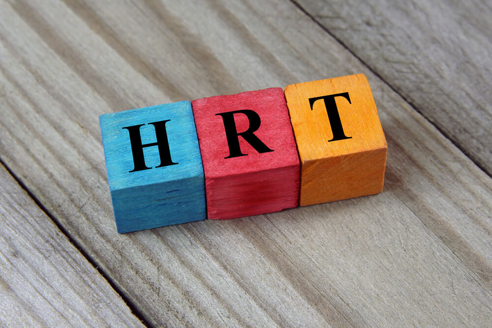 Hormone Replacement Therapy Acronym on Wooden Background