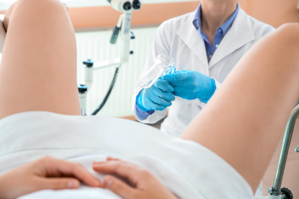 Female Gynecologist Working With Patient in Clinic