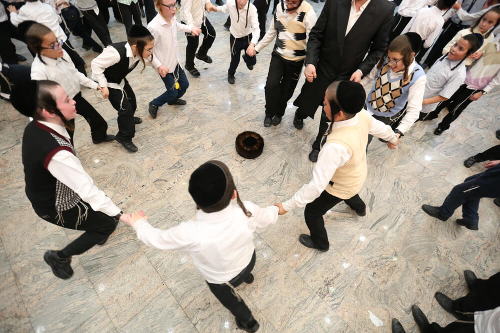 Jewish Men and Boys Take Part in a Grand Party in Honor of the Jewish Holiday
