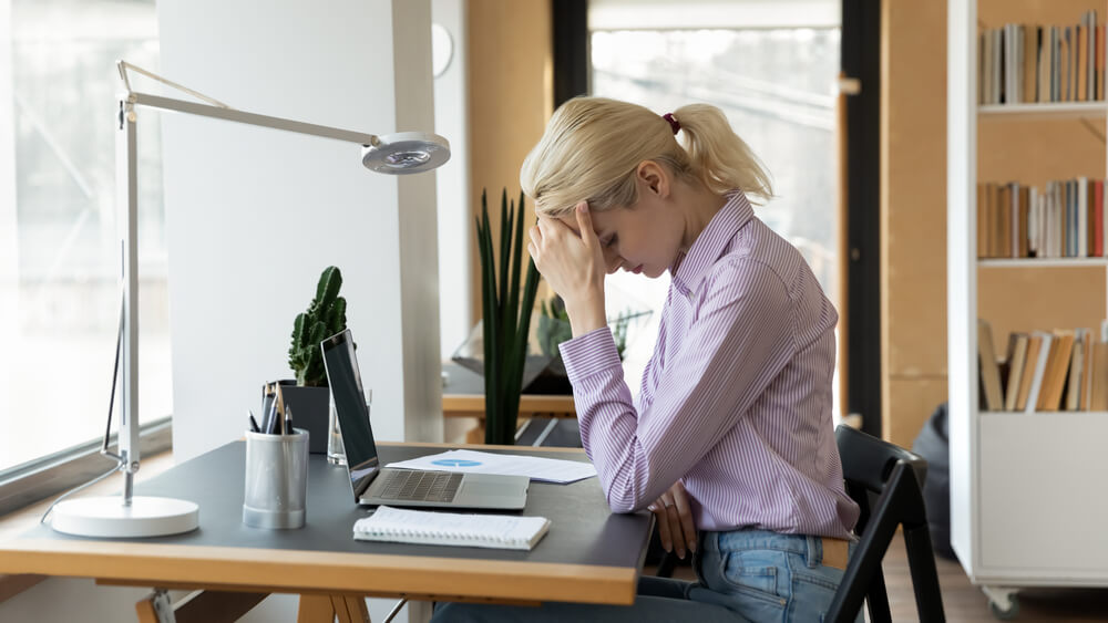 Tired Female Office Employee Feeling Upset, Stress While Working at Computer.