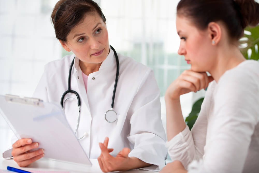 Doctor Explaining Diagnosis to Her Female Patient