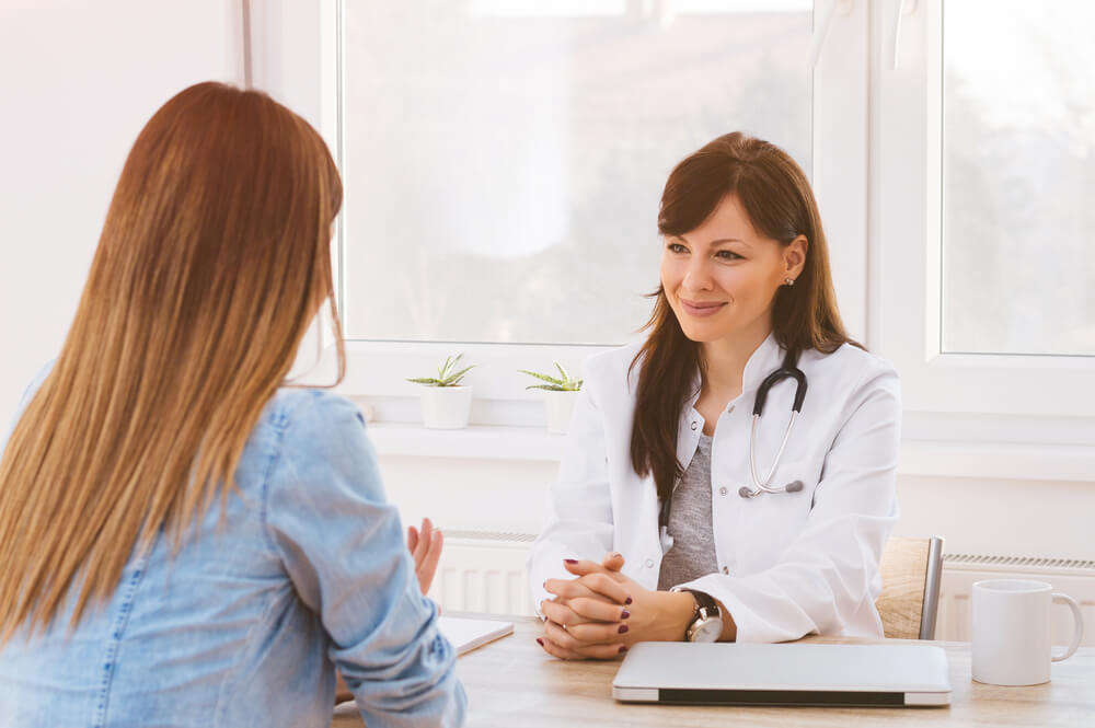 Healthcare and Medical Concept - Doctor With Patient in Hospital