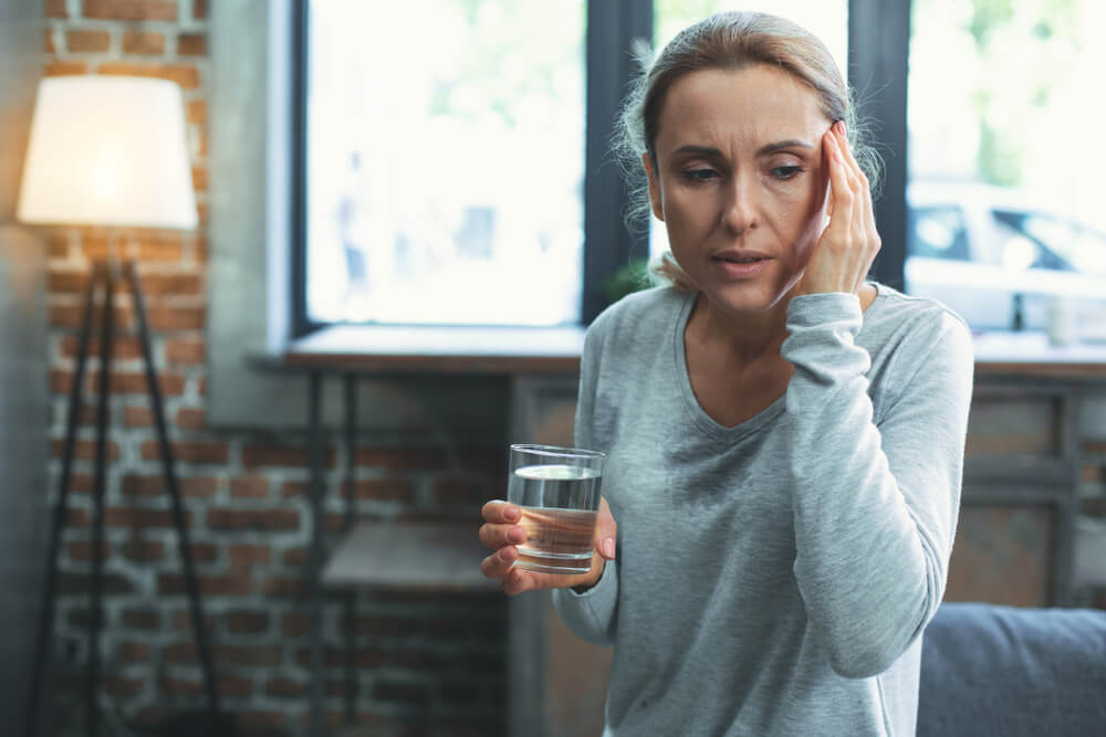 Shortness Of Breath Unhappy Mature Woman Sweating And Touching Head