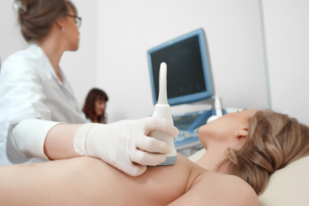 Close up of a Doctor Using Ultrasound Scanner Performing Examination of Breast