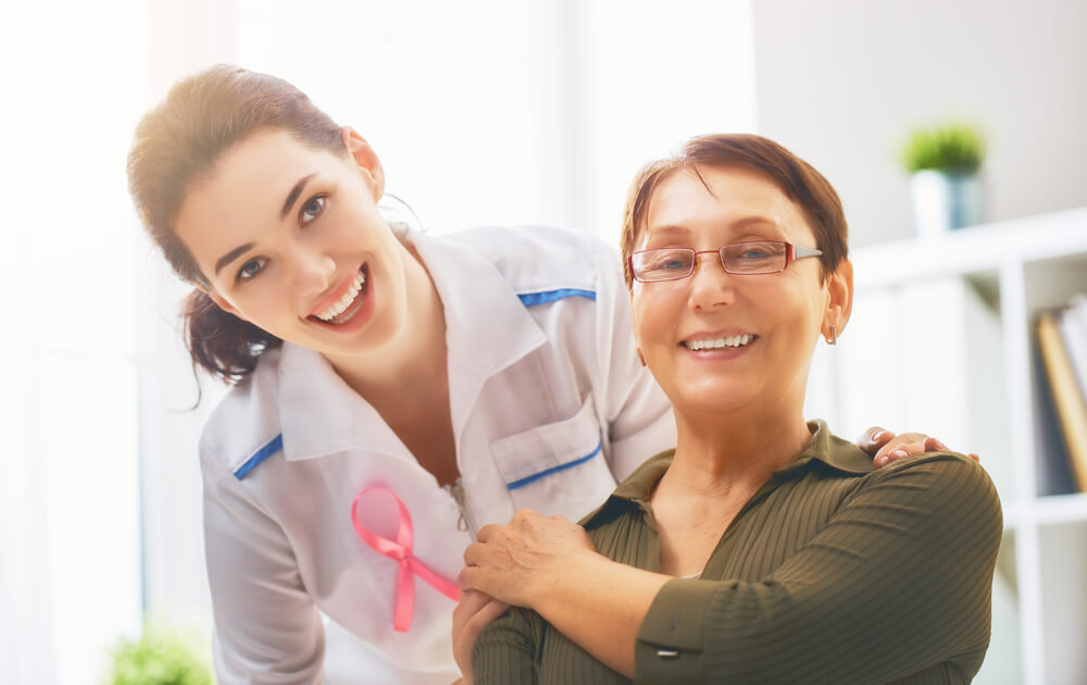 Female Patient Listening to Doctor in Medical Office.