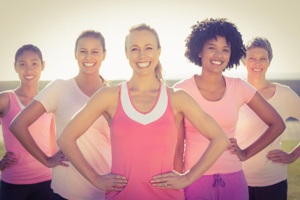 Portrait of Smiling Women Wearing Pink for Breast Cancer and Posing in Parkland