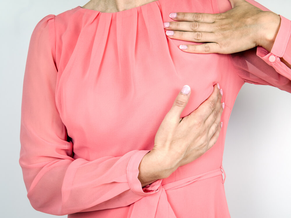 Woman Taking Self Breast Examination Using Hands