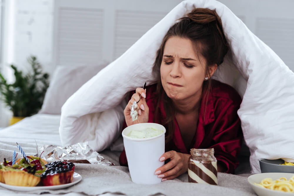 Heartbroken Woman Eating a Lot of Desserts Because of Depression and Huge Stress at Work