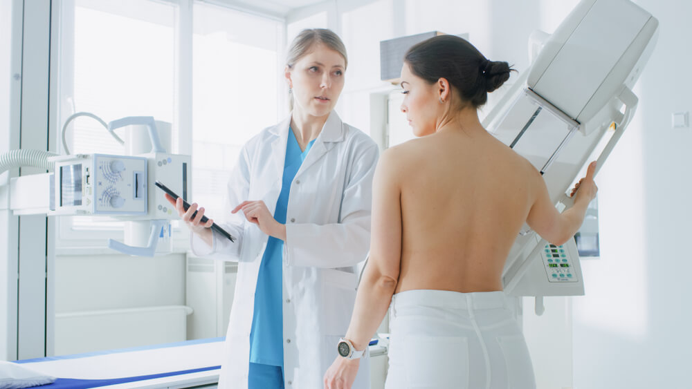 Doctor Uses Tablet Computer, Explains Importance of Breast Cancer Prevention