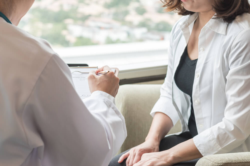 Breast Cancer Awareness Healthcare Concept With Female Patient Having Consultation With Gynecologist