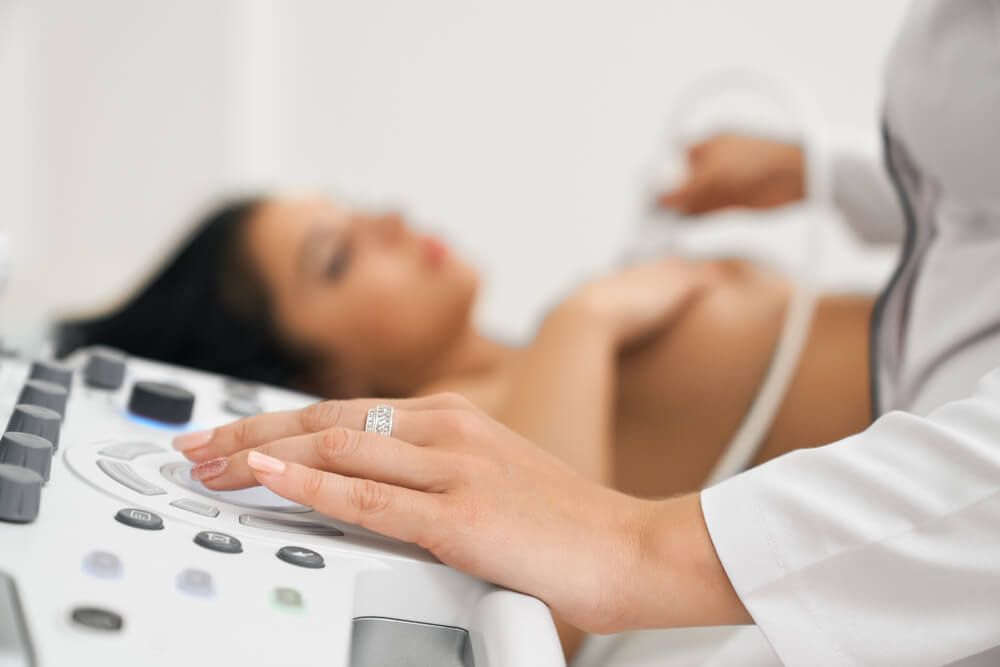 Ultrasound Health Inspection for a Woman With Naked Breast