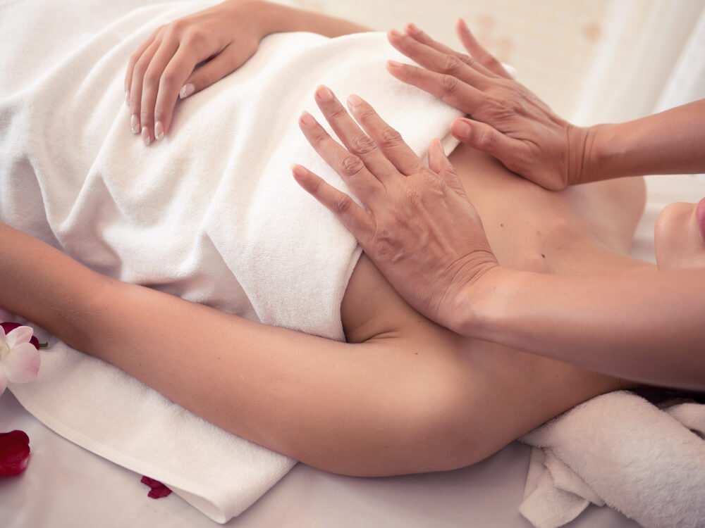 Masseur Doing Massage on Woman Body in the Spa Salon