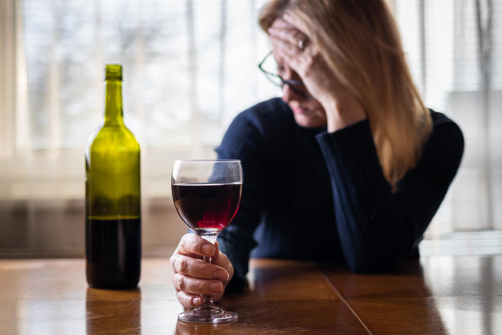Lonely Sad Woman Drinking Red Wine At Home