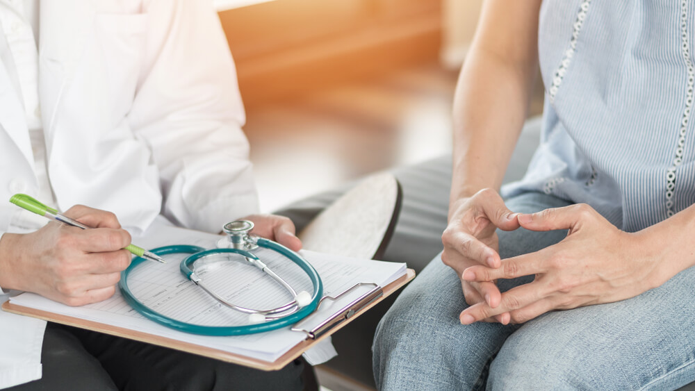 Woman consulting with a doctor.