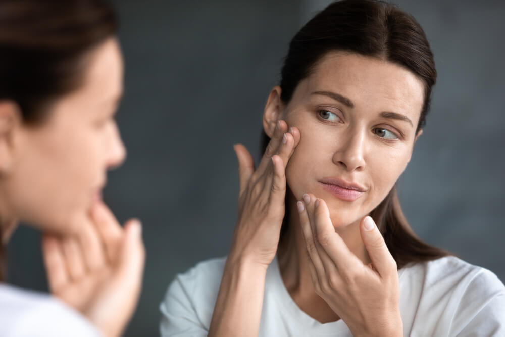 Woman Using Hydrocortisone Cream