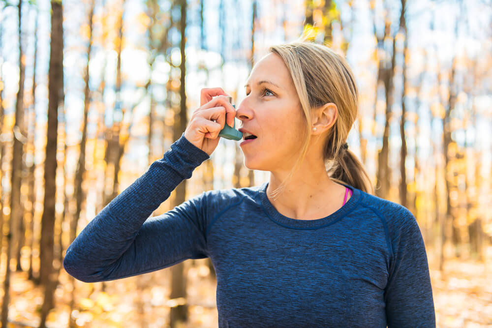 Woman Suffering From Exercise-Induced Asthma 